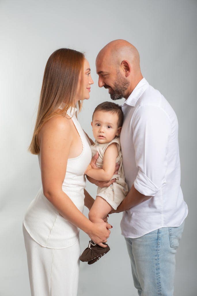 Heartwarming studio portrait of a loving family with a baby.